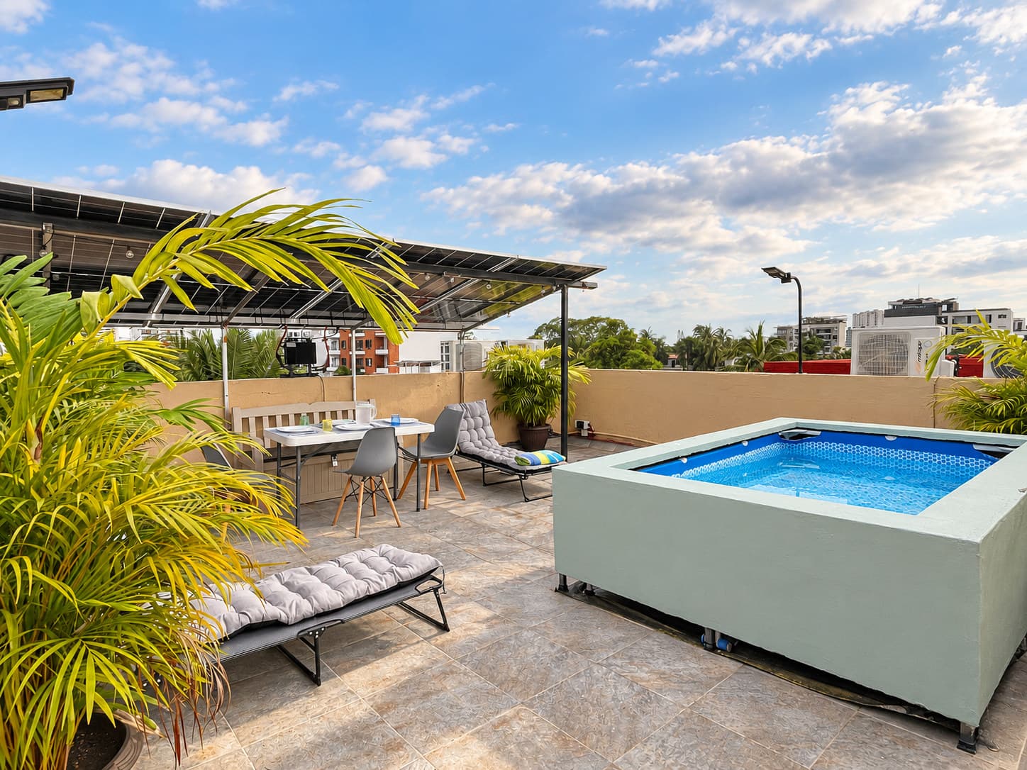 Private rooftop with plunge pool, shade, and greenery at Versalles 837