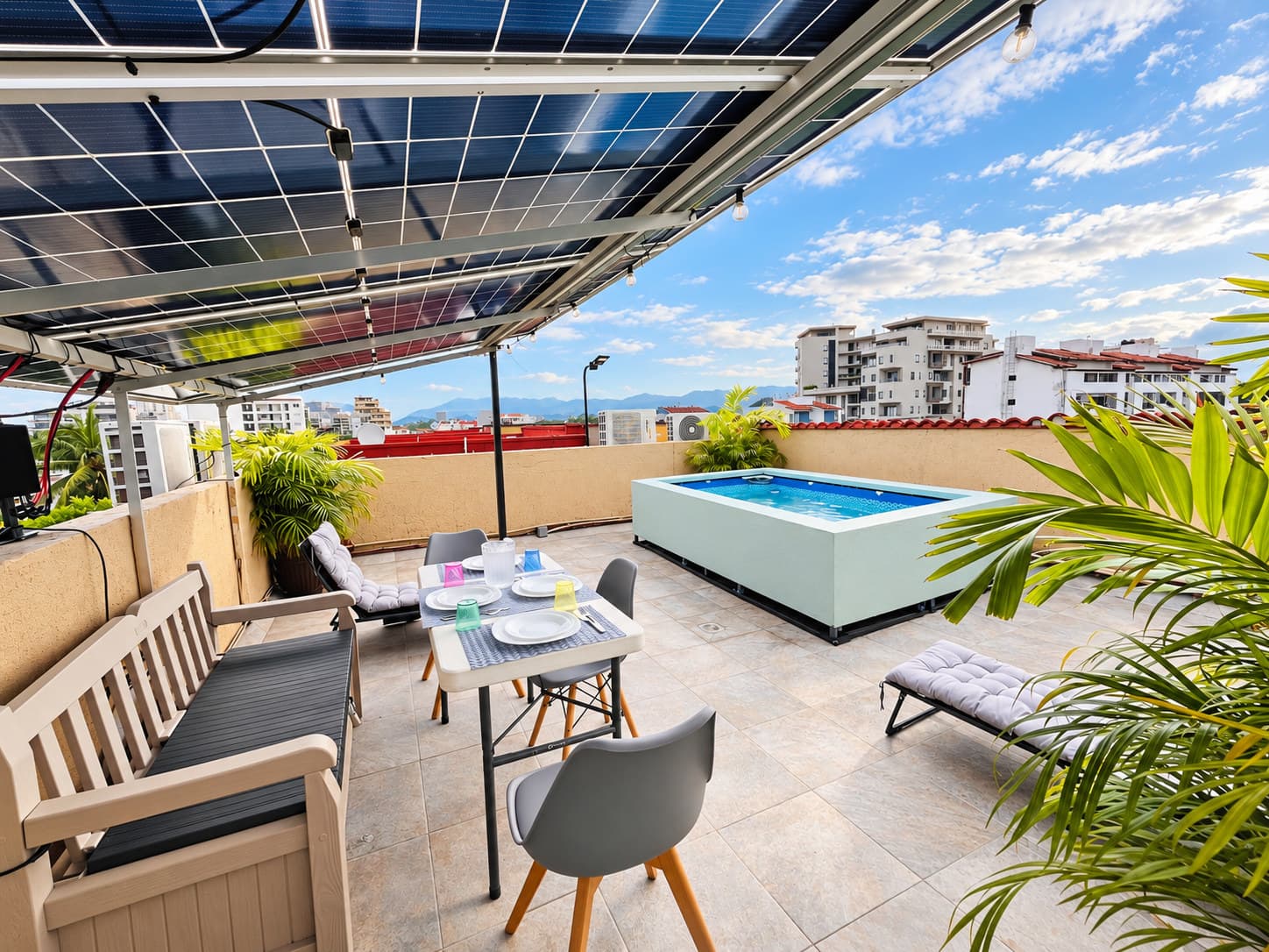 Private rooftop with plunge pool, dining area, and mountain views at Versalles 837