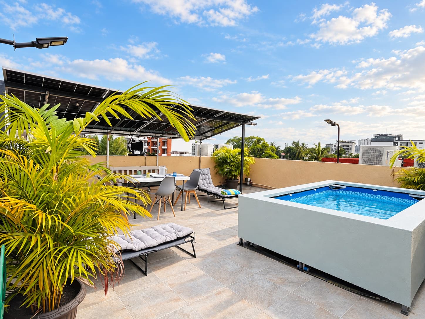 Shaded rooftop area with plunge pool at Versalles 837