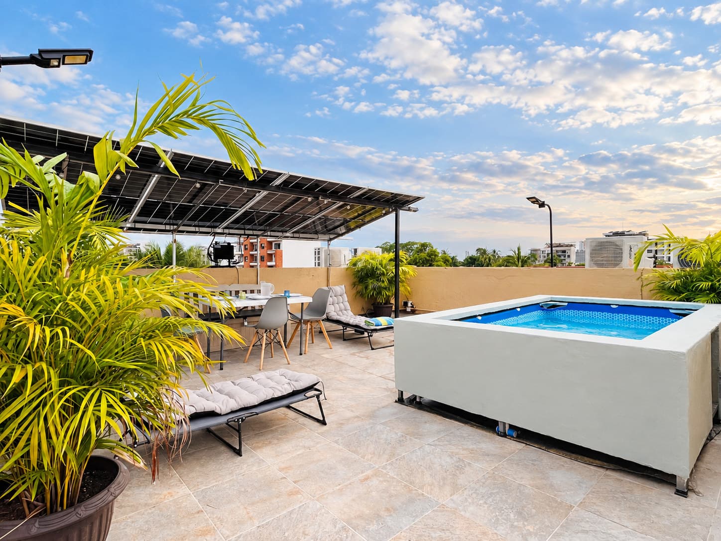 Rooftop with pool, greenery, and lounge area at Versalles 837